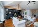 Cozy living room with hardwood floors, built-in shelves, stylish decor, and ample seating for Gathering and guests at 1195 Framptons Inlet Rd, Edisto Island, SC 29438