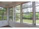 Sunroom featuring large windows providing lots of natural light and views of the outdoors at 1195 Framptons Inlet Rd, Edisto Island, SC 29438