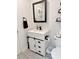 Bathroom features a white vanity with a sliding cabinet door and dark hardware at 1207 Saint Johns Ave, Moncks Corner, SC 29461