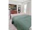 This bedroom has calming gray walls, a view from the accent window, and an entertainment system at 1207 Saint Johns Ave, Moncks Corner, SC 29461