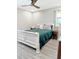 Spacious bedroom with light gray walls, a ceiling fan, and an accent window at 1207 Saint Johns Ave, Moncks Corner, SC 29461