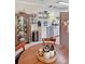Cozy dining area with a wooden table, cabinet, and plenty of natural light at 1207 Saint Johns Ave, Moncks Corner, SC 29461