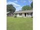 Traditional home with a well-kept lawn, black shutters, and charming curb appeal at 1207 Saint Johns Ave, Moncks Corner, SC 29461