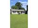 Charming single-story home with a well-manicured lawn and classic curb appeal at 1207 Saint Johns Ave, Moncks Corner, SC 29461