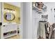Modern bathroom with a round mirror and updated vanity and a peek at the organized closet at 1208 Village Creek Ln Ln # 1, Mount Pleasant, SC 29464