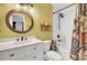 Updated bathroom featuring a round mirror, designer vanity and a shower with black fixtures at 1208 Village Creek Ln Ln # 1, Mount Pleasant, SC 29464