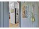 Welcoming foyer with stylish mirror and a glimpse of the modern kitchen beyond at 1208 Village Creek Ln Ln # 1, Mount Pleasant, SC 29464