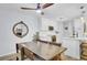 Bright kitchen features white cabinets, stainless steel appliances, a wooden table, and an eye-catching mirror at 1208 Village Creek Ln Ln # 1, Mount Pleasant, SC 29464