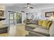 Open concept living room featuring hardwood floors, modern lighting, a sliding glass door, and cozy seating at 1208 Village Creek Ln Ln # 1, Mount Pleasant, SC 29464