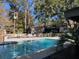 Inviting community pool with clear, blue water, surrounded by lush greenery and lounge area at 1208 Village Creek Ln Ln # 1, Mount Pleasant, SC 29464