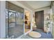Screened-in porch with comfortable seating and access to the living room through a sliding glass door at 1208 Village Creek Ln Ln # 1, Mount Pleasant, SC 29464