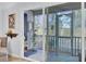Inviting screened-in porch with unique decor, offering a relaxing outdoor space at 1208 Village Creek Ln Ln # 1, Mount Pleasant, SC 29464