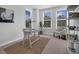 Bright office space filled with natural light, modern decor, desk, chair and decorative rug at 121 Brown Swiss Cir, Summerville, SC 29483