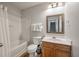 Bathroom featuring a vanity and mirror, a tub with shower, and neutral decor at 1219 Bradley Blvd, Summerville, SC 29486