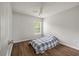 Bedroom with wood-look flooring, ceiling fan and natural light from a window at 1219 Bradley Blvd, Summerville, SC 29486