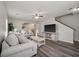 Inviting living room with wood floors, neutral decor, and plenty of natural light at 1219 Bradley Blvd, Summerville, SC 29486