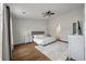 Bright main bedroom boasts a ceiling fan, wood floors, and a serene decor at 1219 Bradley Blvd, Summerville, SC 29486