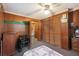 Bedroom featuring wood paneling, closet, and ceiling fan at 1263 N Highway 52, Moncks Corner, SC 29461