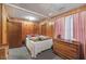 Cozy bedroom featuring wood paneling, comfortable furnishings, and a warm, inviting atmosphere at 1263 N Highway 52, Moncks Corner, SC 29461