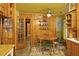 Eat-in kitchen features wood cabinets, cozy dining area, and natural light, perfect for Gathering meals at 1263 N Highway 52, Moncks Corner, SC 29461
