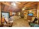 Living room featuring wood paneling and ceiling fans at 1263 N Highway 52, Moncks Corner, SC 29461