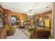 Inviting living room with wood paneling, connecting doorways, ample natural light, and comfortable seating at 1263 N Highway 52, Moncks Corner, SC 29461
