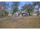 Rear exterior view of a home with a carport and ample yard space at 1263 N Highway 52, Moncks Corner, SC 29461