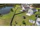 Backyard aerial showing patio, trampoline, firepit, and pond view at 160 Brookhaven Rd, Summerville, SC 29486