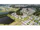 Aerial view of a suburban neighborhood featuring well-maintained lawns, a community pond, and a cul de sac at 160 Brookhaven Rd, Summerville, SC 29486