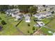 Aerial view of a fenced-in yard, with a play set, fire pit, and concrete patio at 160 Brookhaven Rd, Summerville, SC 29486
