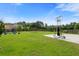 Large backyard with playset, basketball hoop, patio, and well-maintained lawn at 160 Brookhaven Rd, Summerville, SC 29486