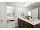 Bathroom with double sink vanity, and doorway view into the main bedroom at 160 Brookhaven Rd, Summerville, SC 29486