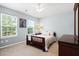 Charming bedroom with bright windows, ceiling fan, bed, and dark wood dresser at 160 Brookhaven Rd, Summerville, SC 29486