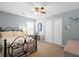 Comfortable bedroom with black iron bed, closet, ceiling fan, and soft lighting at 160 Brookhaven Rd, Summerville, SC 29486