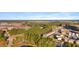 An aerial view showcases the Cane Bay community surrounded by lush trees and walking trails at 160 Brookhaven Rd, Summerville, SC 29486