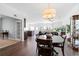 Open-concept dining room with hardwood floors, a chandelier, and seamless flow to the living areas at 160 Brookhaven Rd, Summerville, SC 29486