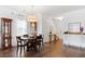 Bright dining room with wood floors, chandelier, display cabinet, and window with natural light at 160 Brookhaven Rd, Summerville, SC 29486
