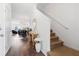 Welcoming entryway with wood floors, a staircase, and stylish decor, leading to the living spaces at 160 Brookhaven Rd, Summerville, SC 29486