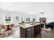 Open-concept kitchen featuring an island with a granite countertop and stainless steel appliances at 160 Brookhaven Rd, Summerville, SC 29486