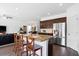 Gourmet kitchen features granite countertops, stainless steel appliances, and bar stool seating at the island at 160 Brookhaven Rd, Summerville, SC 29486