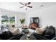 Comfortable living room featuring leather sofas, large window, and a decorative rug, creating a cozy atmosphere at 160 Brookhaven Rd, Summerville, SC 29486