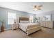 Spacious main bedroom boasts a king bed, ceiling fan, two windows, and dresser at 160 Brookhaven Rd, Summerville, SC 29486