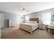 Bright main bedroom with king bed, ceiling fan, two windows, and dresser with mirror at 160 Brookhaven Rd, Summerville, SC 29486