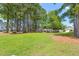 Lush green park with picnic tables and tall trees offering shade, ideal for relaxing outdoors at 160 Brookhaven Rd, Summerville, SC 29486