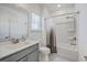Well-lit bathroom featuring a combination tub and shower and a modern gray vanity at 175 Darby Meadow Ln, Ridgeville, SC 29472