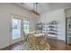 Charming dining area with modern light fixture and view of the backyard at 175 Darby Meadow Ln, Ridgeville, SC 29472