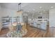 Open concept kitchen with gray cabinets, stainless steel appliances, and adjacent dining area at 175 Darby Meadow Ln, Ridgeville, SC 29472