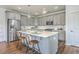 Modern kitchen with gray cabinetry, stainless steel appliances, and center island with seating at 175 Darby Meadow Ln, Ridgeville, SC 29472