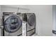 Modern laundry room with a front-load washer and dryer at 175 Darby Meadow Ln, Ridgeville, SC 29472