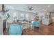 Open-concept living room with hardwood floors, fireplace, and abundant natural light at 175 Darby Meadow Ln, Ridgeville, SC 29472